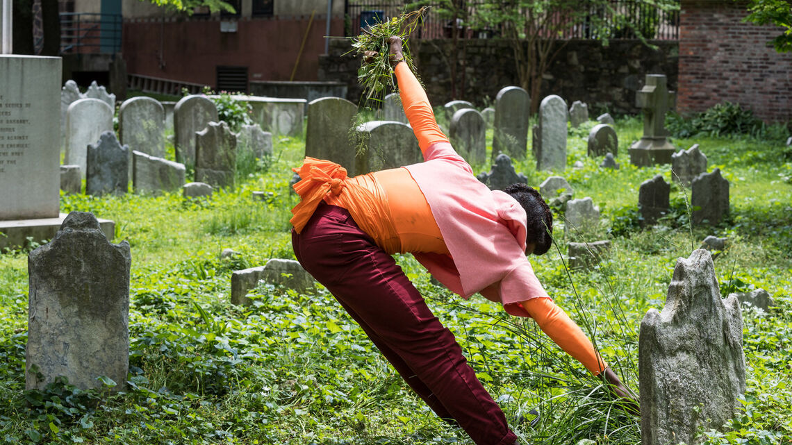 Person dancing in a cemetary