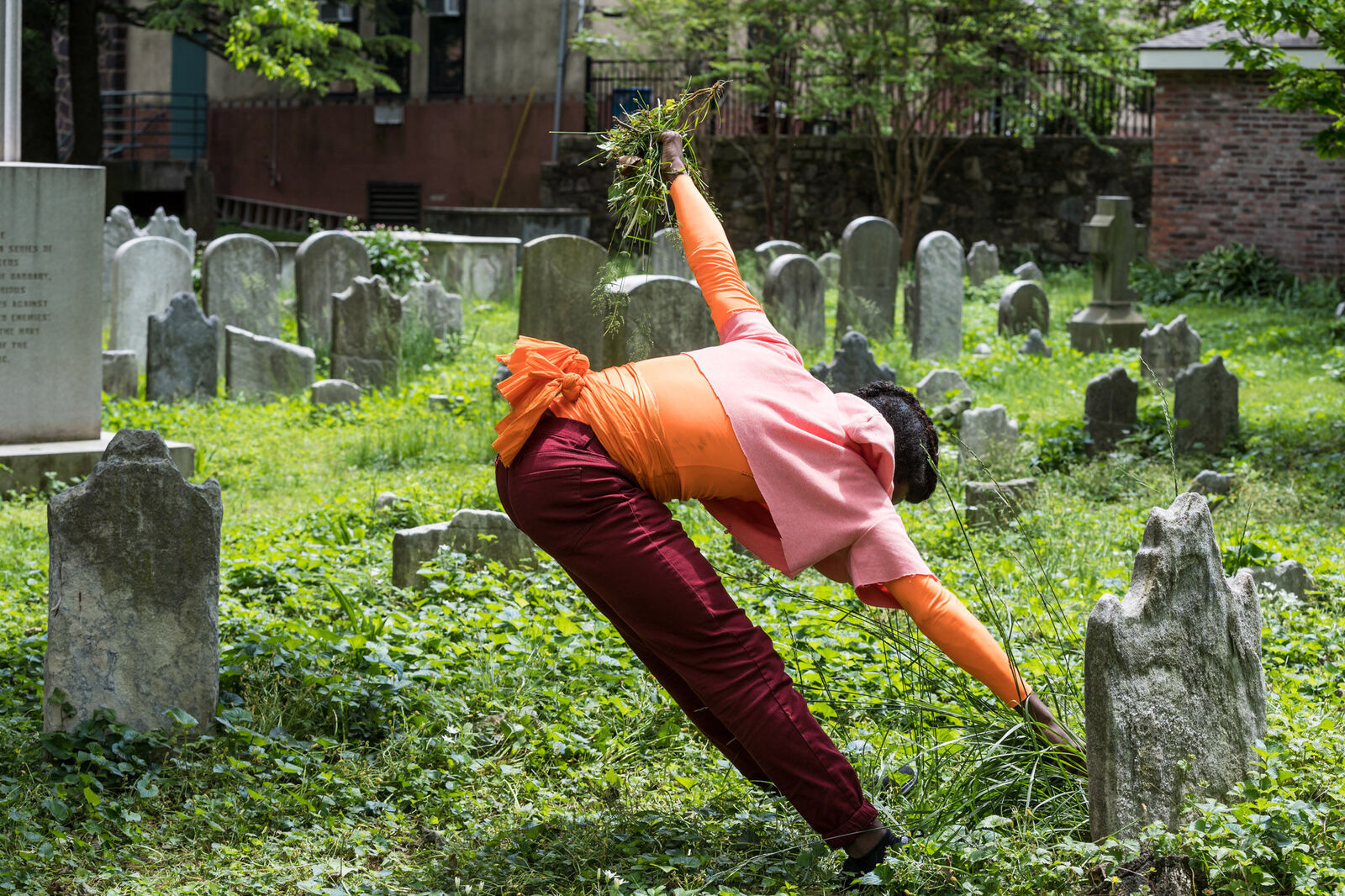 Person dancing in a cemetary