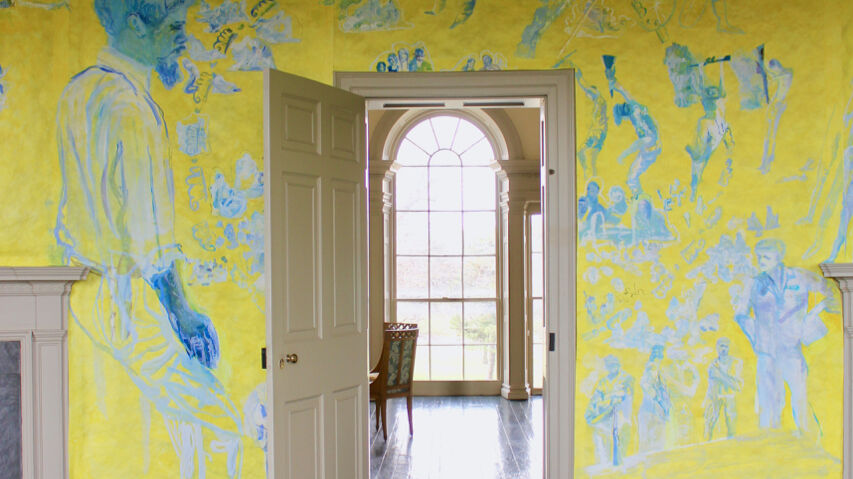 a yellow and blue room with an open door