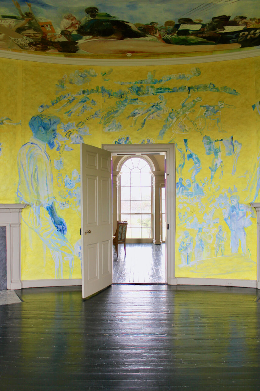 a yellow and blue room with an open door