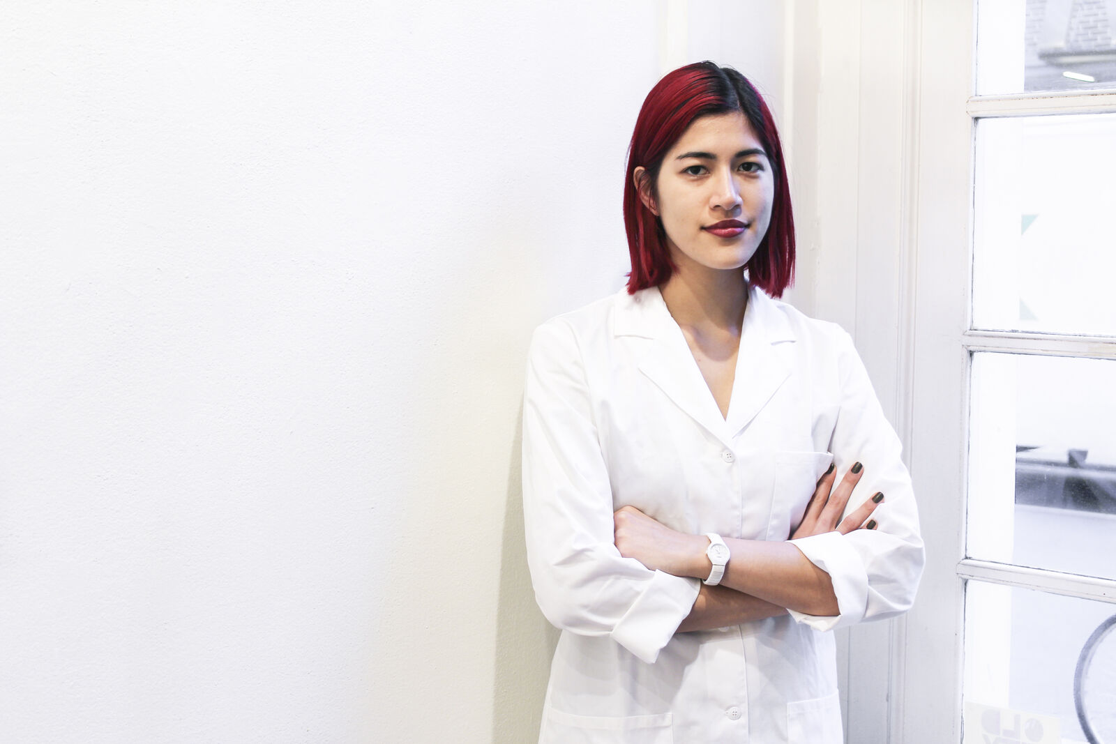 Image of woman with red hair in white lab coat