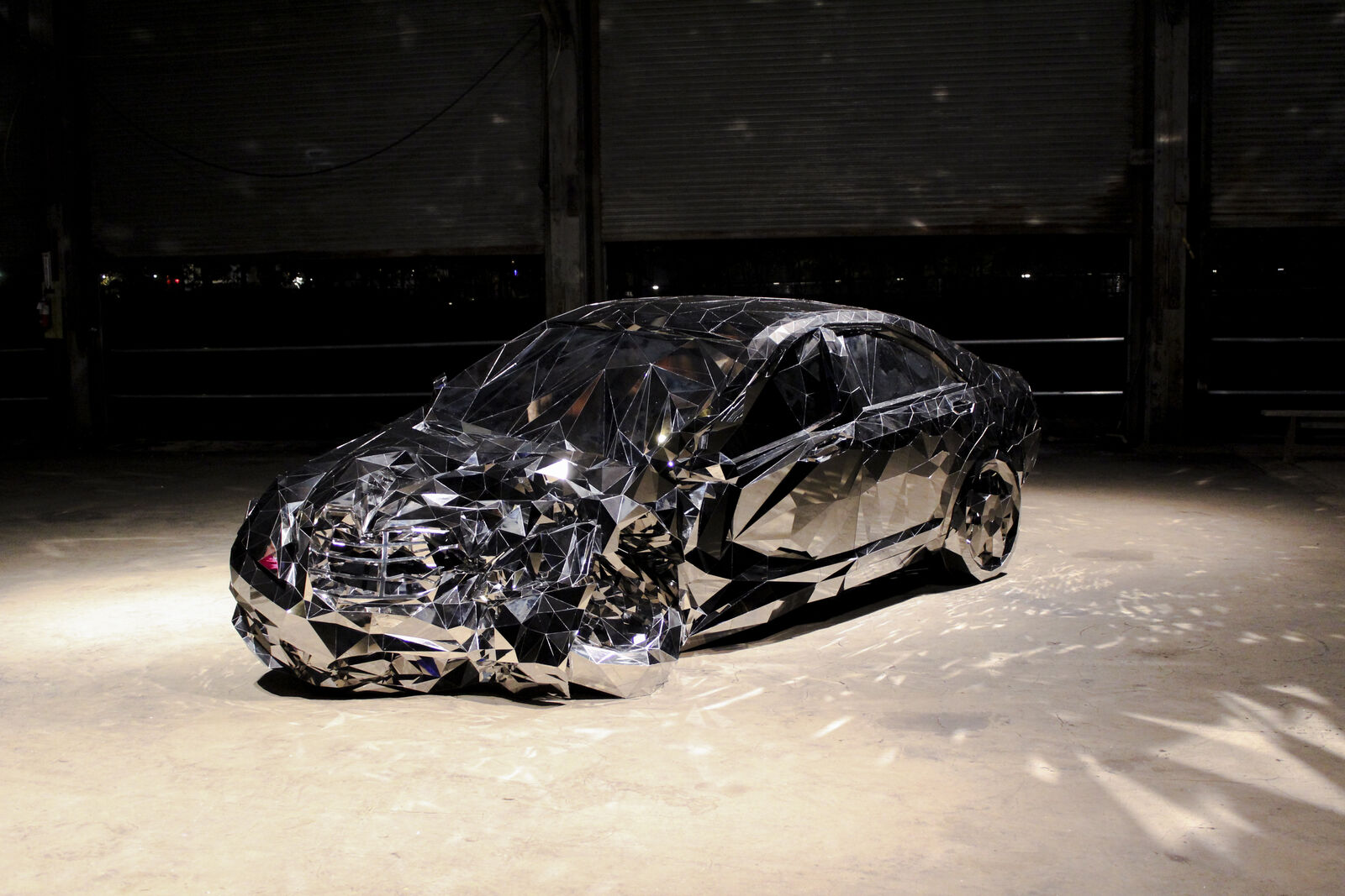 sculpture of wrecked car