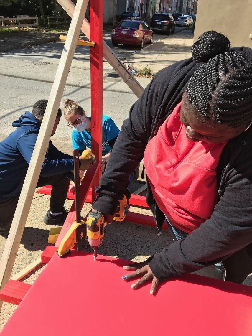 young people working on a pergola