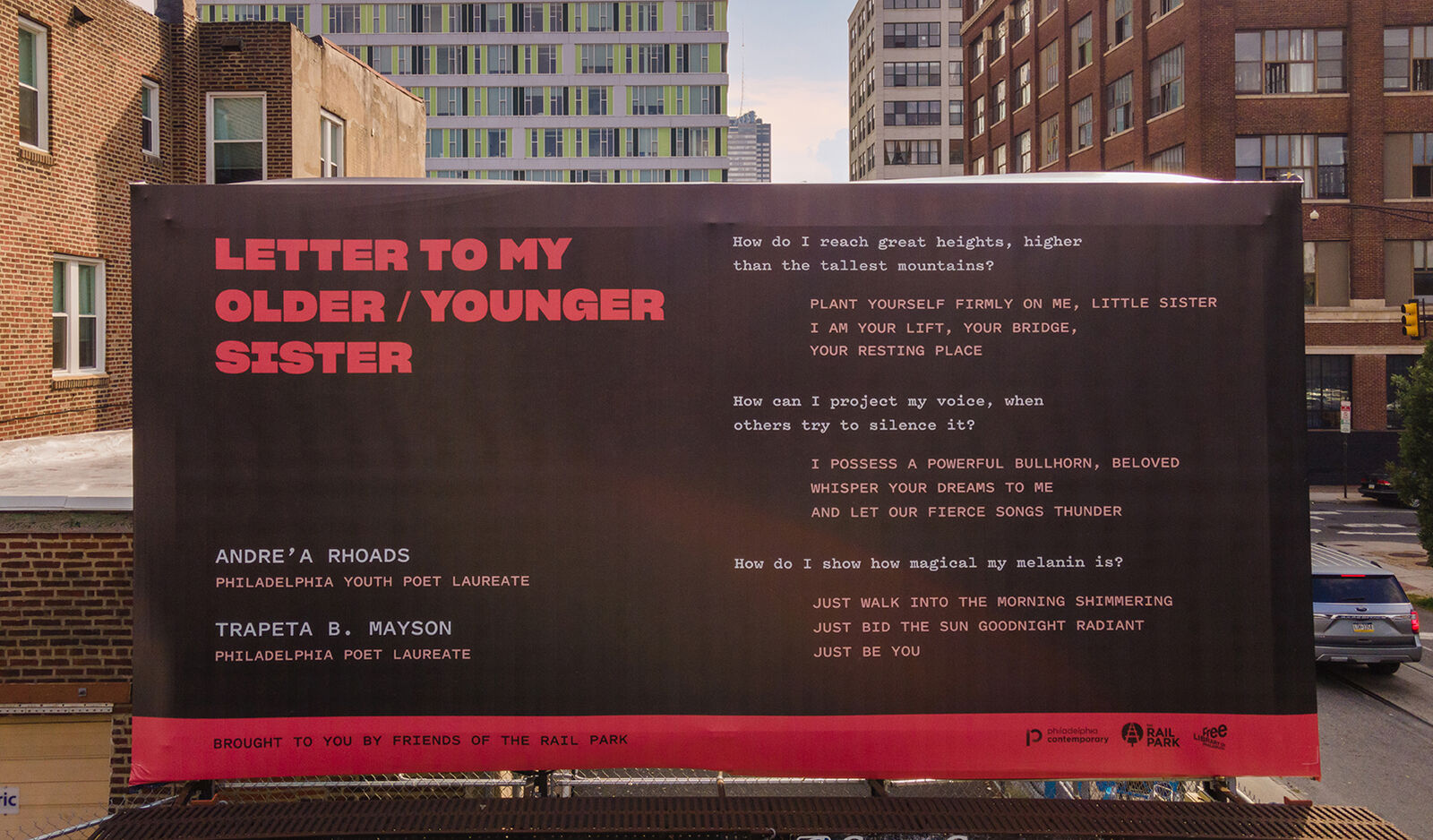 billboard with poem titled "Letter to my older/younger sister", a poem featuring a back and forth conversation between two poets