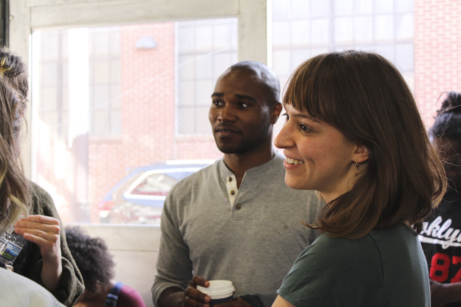 people enjoy beverages and chat at the outbound poetry festival